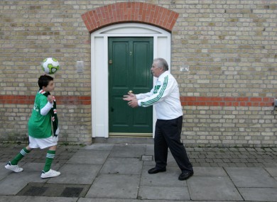 John Giles with a young footballer this week after he was announced as the Grand Marshal for this year's Patrick's Day parade