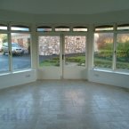 Conservatory overlooking the fully landscaped grounds. (Image: SherryFitzgerald/Daft.ie)