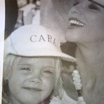 #ThrowbackThursday guess who that little girl on my lap is? Sending masses of love @caradelevingne