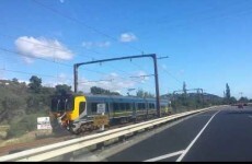 Two teenagers caught on camera clinging to the back of a speeding train