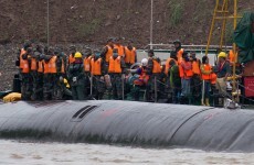 Families hope for a miracle to save passengers trapped in overturned cruise ship