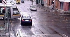 Worrying red light photos show impatient driver in near-miss with tram