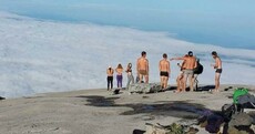 Tourists who stripped naked on a Malaysian mountain blamed for earthquake and now facing jail
