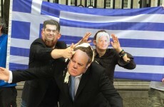 Alexis Tspiras throws feta cheese and Greek yoghurt at Michael Noonan outside Leinster House*