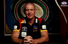 A top Aussie Rules head coach was stabbed to death and his son's been charged with murder
