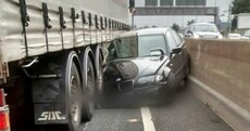 Remarkably, no-one was hurt when this car was crushed by a truck