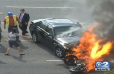 Bystanders rescue motorcyclist trapped beneath burning car