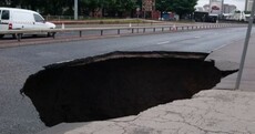 Yikes! This enormous hole opened up in a road in Manchester today