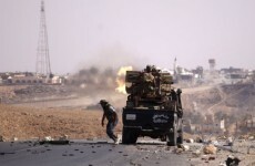 Libyan forces pull back after fierce battles in Gaddafi's hometown