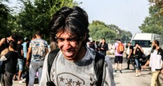 Photos: Migrants treated for suffocation and broken bones after police crackdown