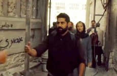 This graffiti in the background of Homeland reads 'Homeland is racist'