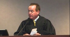 Judge accused of asking an FBI agent to spy on his family in exchange for free beer