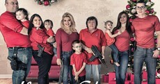 US politician posts Christmas portrait showing family posing with guns