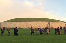 Rain clouds dull winter solstice for crowds at Newgrange