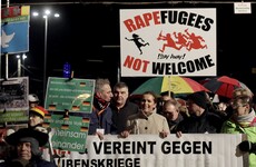 More than 200 arrested after protesters smash cars at anti-refugee rally in Germany