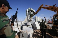 Libyans bulldoze Gaddafi's Tripoli compound