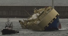 An enormous ship has been towed to Spain after it listed almost completely to one side