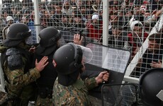Tear gas fired as migrants try to storm Greece-Macedonia border fence
