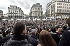 A minute's silence in Brussels was ended with defiant applause