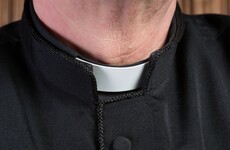 Priest suspended after being charged with paying teenage boy for sex