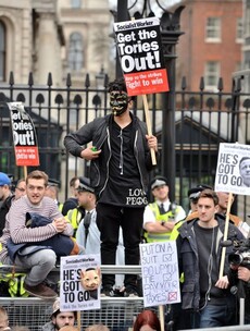 'Blame me' Cameron tells Tories as protesters call for him to go
