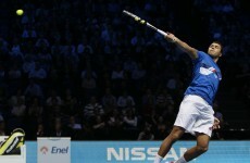 Tsonga stuns Nadal as Federer marches on