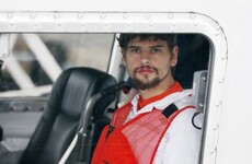 Man found in raft after mother was lost at sea was suspect in grandfather's killing