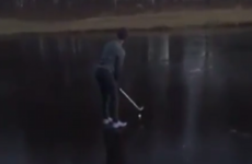 This eejit golfer tried to play a shot off a frozen water hazard (with predictable consequences)