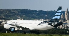 Two men used fake weapons to hijack Libyan plane