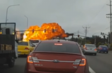 Somehow nobody was injured when this plane hit power lines and crashed onto a road