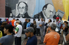Candidate shot dead as Venezuelans line up to vote in controversial election
