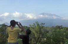 Thousands evacuate Bali as smoke spews from volcano for first time in 50 years