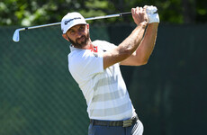 Top-ranked Johnson grabs share of US Open lead