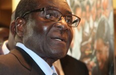 Mugabe  arrives home - reports of illness "hogwash"
