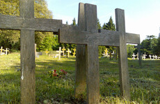 Why can't the remains of 5 unidentified men buried in Ireland be exhumed for DNA testing?