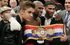 Mayweather overcomes Cotto, poses with Justin Bieber