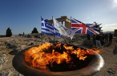 Olympic flame within reach of London Games chiefs