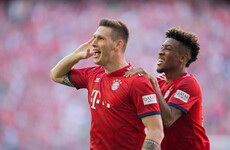 Bayern remain ahead of Dortmund after Süle strike edges champions past 10-man Bremen