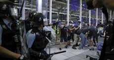 Chaos at Hong Kong airport as riot police clash with pro-democracy protesters staging sit-in