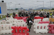 Hong Kong activists block routes to airport after violent clashes in metro station