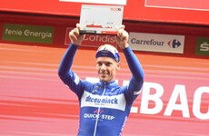 Gilbert claims Vuelta 12th stage, Roglic retains red