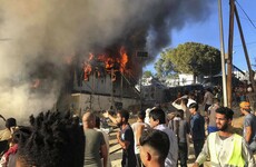 Greece says it wants to begin returning 10,000 migrants after deadly fire sparks riots