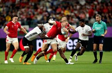 Wales secure quarter-final berth after bruising battle against Fiji
