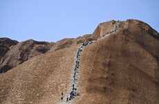 Tourists rush to climb Uluru on the last day before doing so is banned