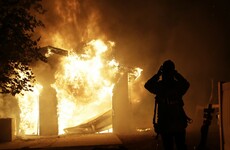 Tens of thousands evacuated as wildfires rage in California