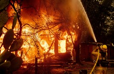 Tens of thousands flee their homes as US emergency services battle fierce wildfires