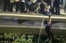 Hong Kong: Student protesters escape police siege by climbing down ropes to waiting motorbikes