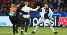Double trouble as Cristiano Ronaldo rages at selfie-hunting pitch invader