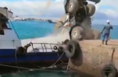 Crane collapses onto boat spilling oil into Galapagos Islands harbour