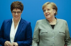 Favourite to replace Angela Merkel stands down amid far right row